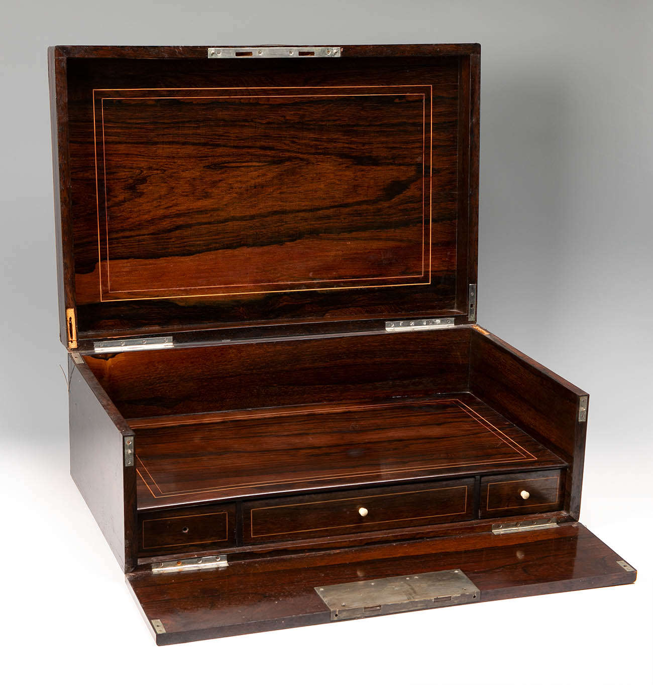 Portable writing-box. England, late 19th century.Rosewood frame with oriental-inspired decoration