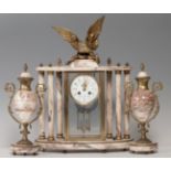 French school 19th century.Empire clock in pink marble and mercury gilt bronze.No key. In need of