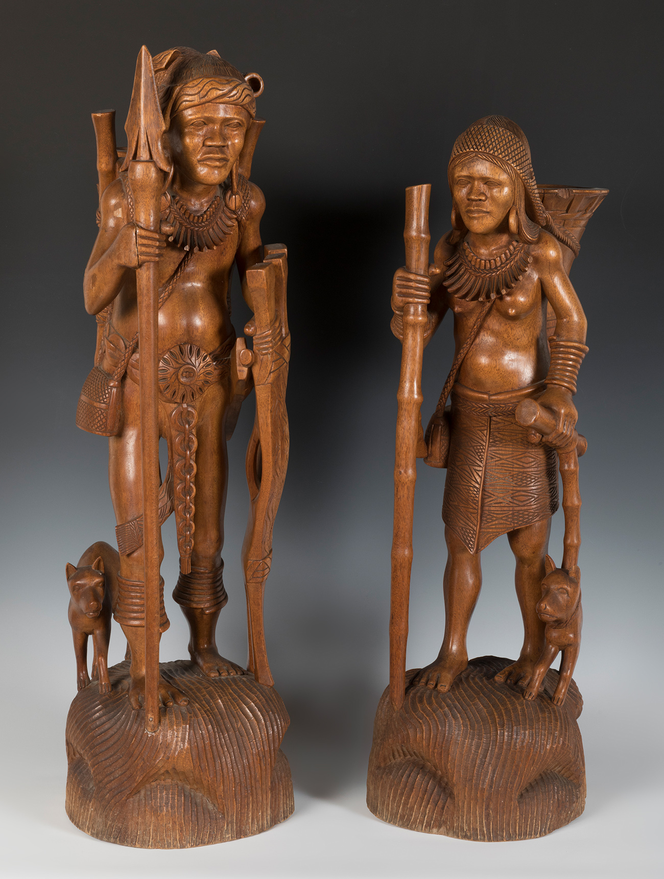 Peasant couple. Philippines, mid-20th century.Carved wood.Stamps on the reverse.Restorations on
