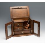 Tobacco box from the 20th century.Walnut wood.Includes pipe and key.The lid does not close