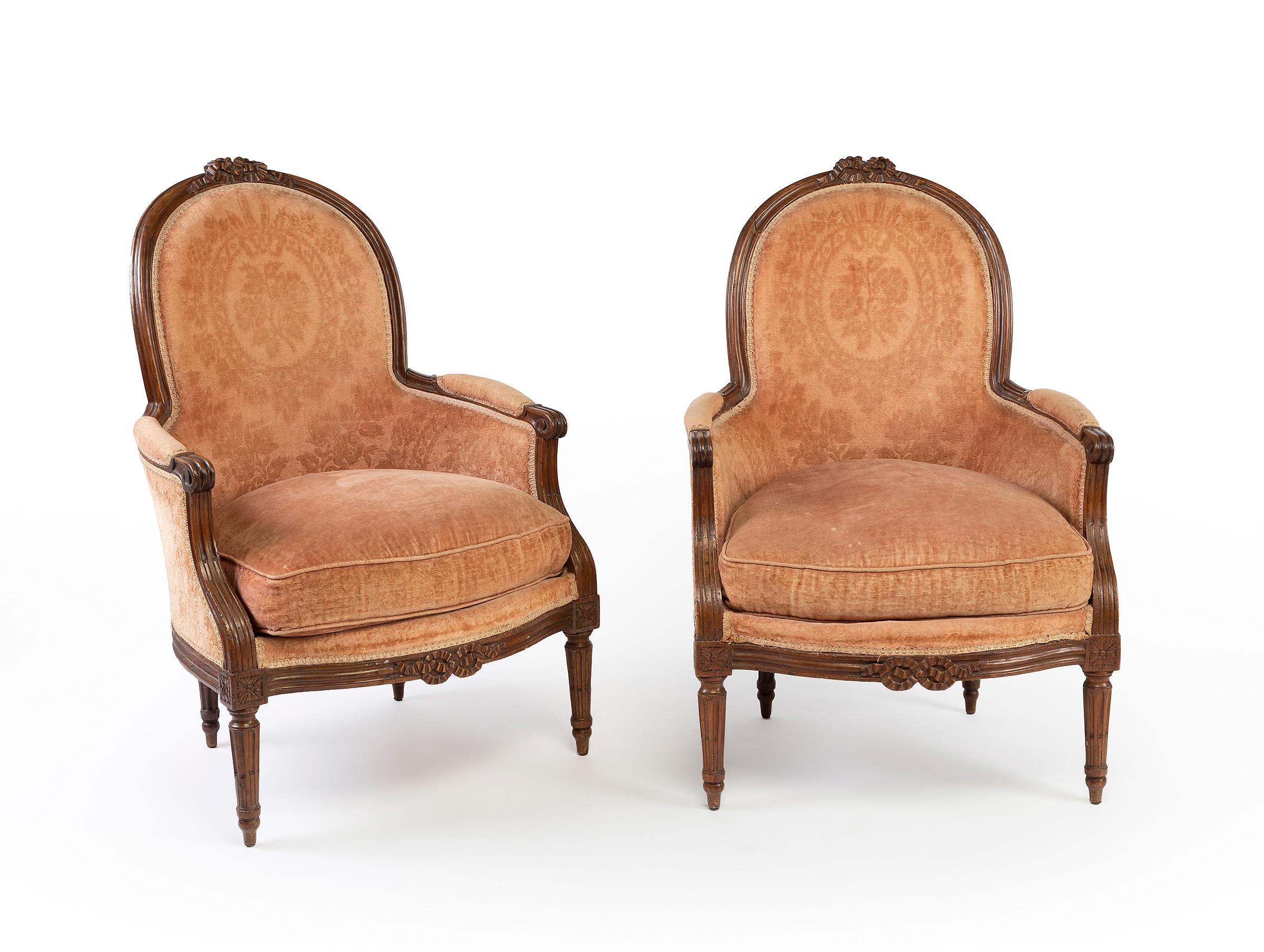 Set of two Louis XVI armchairs, second half of the 18th century, and a matching footrest of later