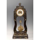 French school 19th century.Table clock.Chicaranda, metal and marquetry of metal and semi-precious