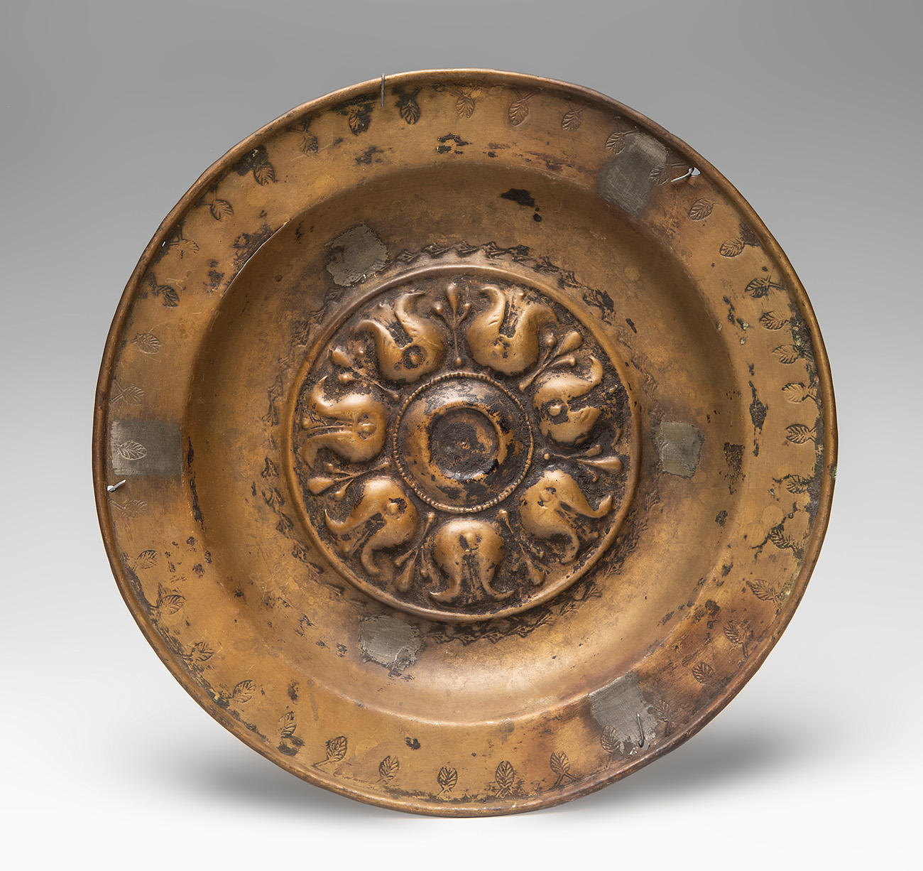 Petition plate. Germany, possibly Nuremberg, 17th century.Gilded copper."Pomegranates".Measurements: