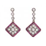 Pair of long art deco earrings in rose gold with diamonds and rubies. Calibrated rubies and diamonds