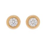 Pair of 18k yellow gold earrings. With central brilliant-cut diamonds, total weight ca. 0.50 ct.
