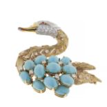 Swan-shaped brooch, in 18 kt two-tone gold, with the body of the bird with twelve turquoises, with a