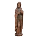 French (or Flemish), Late 15th / Early 16th Century, A wooden statue of St. John the Evangelist hold
