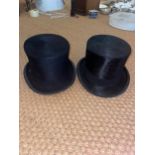 NO RESERVE: A pair of black silk top-hats (Siamese twins?)