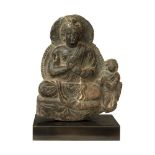 Gandhara, 2nd Century AD, A seated Buddha and devotee
