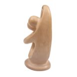 A hard stone homunculus paperweight