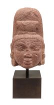 Indian, 10th - 14th Century, A carved red stone Buddha's head