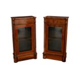 A pair of Regency mahogany glazed side cabinets