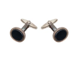 NO RESERVE: A pair silver fisheye cufflinks, An 18/9 carat dress set by Gowland Bros. Lt