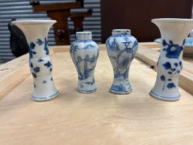 A selection of fine porcelain items: four miniature blue and white urns, as well as a porcelain plat