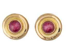 Circa 1980, A pair of 18 carat gold and cabochon ruby cufflinks and buttons suite