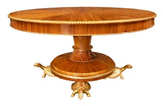 Circa 1900, A mahogany and giltwood centre table, with tortoise feet