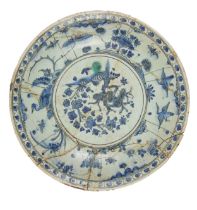 Safavid, 17th Century, A large blue and white pottery dish (with damages)