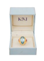 Kiki Mcdonough, A pear-shaped blue topaz and red tourmaline 18 carat yellow gold dress ring