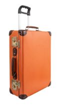 Globe Trotter, A pair of orange leather hard shell suitcases