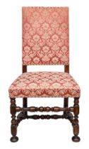 17th Century, A pair of William and Mary walnut side chairs upholstered in dry blood damask