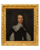 Circle of Sir Anthony Van Dyck (1599 - 1641), A portrait of a young man in black jacket with white r