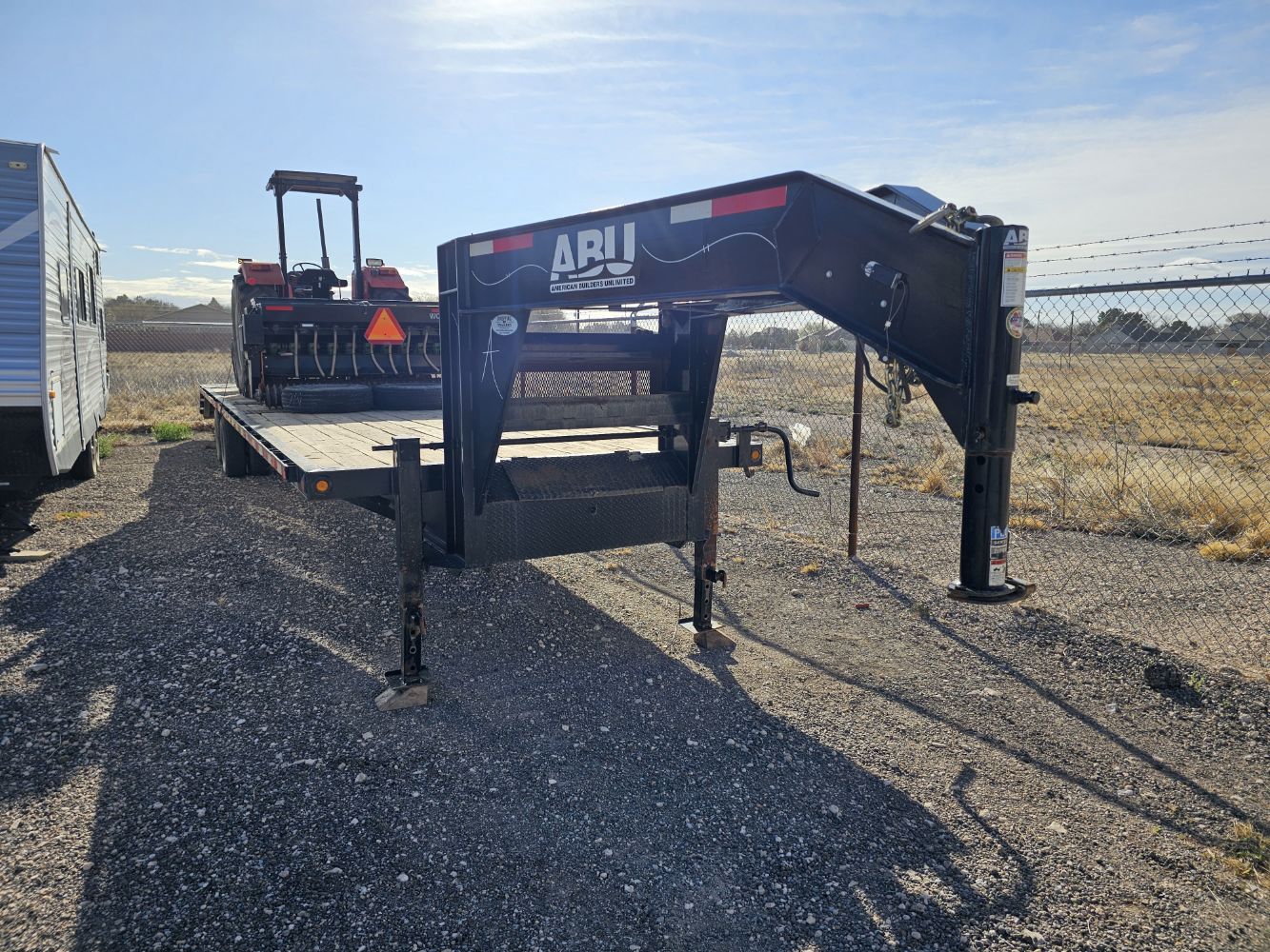 Gooseneck trailer, farm tractor and seeder-Grit Energy services Inc.