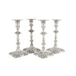 Two Near Matching Pairs of George III Silver Candlesticks, Ebenezer Coker and John Cafe, London, 176