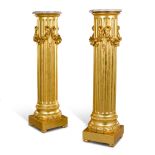 A pair of carved giltwood columns, modern