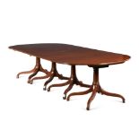 A Regency style mahogany four-pillar dining table