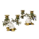 A pair of Louis XV gilt-bronze mounted Chinese white porcelain two-light candelabra, the porcelain 1