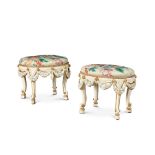 A pair of painted and parcel-gilt oval stools, probably Italian, early 20th century