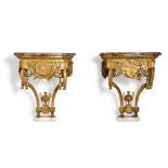 A pair of Louis XVI carved giltwood console tables, circa 1775, in the manner of Jean Charles Delafo