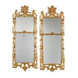 A pair of George II style carved giltwood and gesso wall mirrors