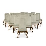 A set of twenty George I style walnut and parcel-gilt dining chairs, early 20th century