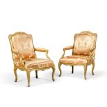 A pair of Louis XV carved giltwood fauteuils &#224; la reine, by Pierre or Louis Falconet, mid-18th