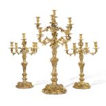 A Victorian silver-gilt suite of candelabra, R&S Garrard & Co., London, 1848 (the pair) and 1861 (th