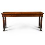 A George IV brass-mounted carved mahogany side table, circa 1825, in the manner of Gillows