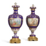 A pair of S&#232;vres style gilt-metal mounted dark blue ground ovoid vases and covers, circa 1860