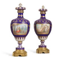 A pair of S&#232;vres style gilt-metal mounted dark blue ground ovoid vases and covers, circa 1860