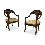 A pair of Regency simulated-coromandel 'Roman' open armchairs