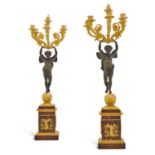 A pair of Empire gilt and patinated bronze five-light candelabra, early 19th century, attributed to