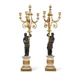 A pair of French bronze and marble three-light candelabra, late 19th century