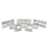 A group of seventy-six cased silver salt and pepper shakers, Cartier, 20th century