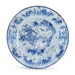 An English delftware initialed and dated large Chinoiserie dish, 1698, attributed to Brislington