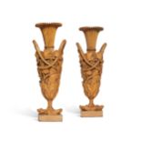 A pair of Directoire carved fruitwood vases, circa 1800, in the manner of Aubert Parent