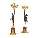 A pair of Empire gilt and patinated bronze six-light candelabra, early 19th century