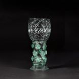 An important Dutch diamond-point engraved calligraphic green glass roemer, 17th century