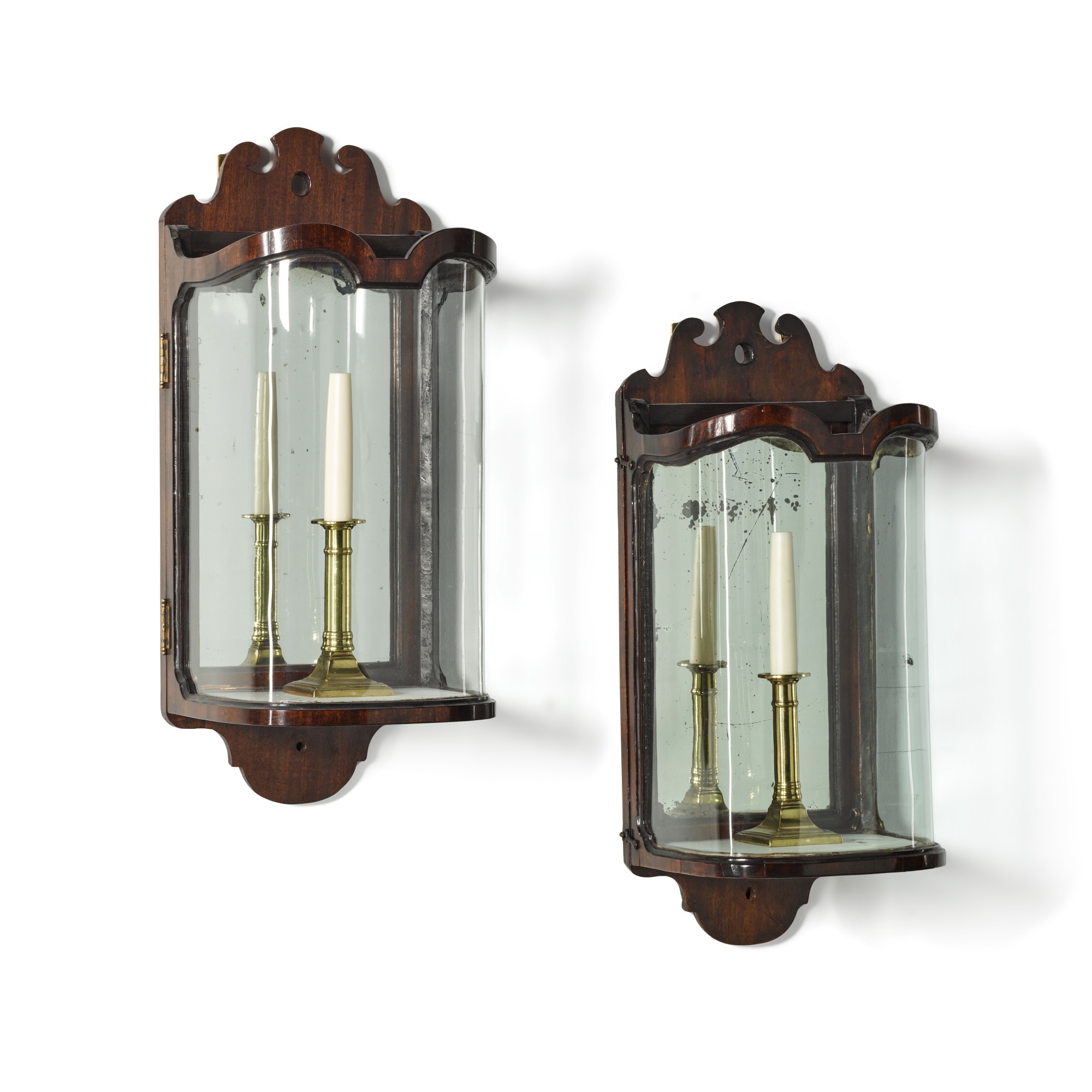 A George III mahogany, mirrored and glazed wall-lantern, circa 1760, together with a matching lanter