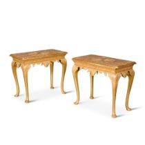 A pair of George I style carved giltwood and gilt-gesso side tables