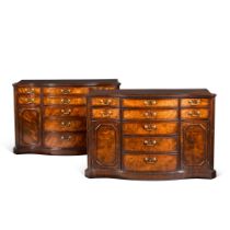 A pair of George III mahogany serpentine commodes, circa 1765, attributed to Wright and Elwick